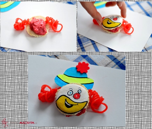 Fülle die Macarons mit Erdbeercreme.